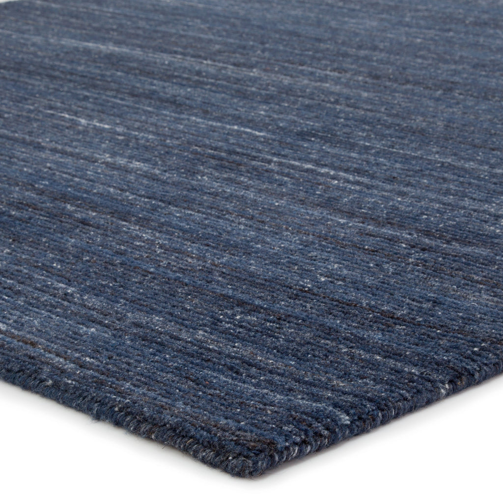 vassa solid rug in blue wing teal sky captain design by jaipur 2